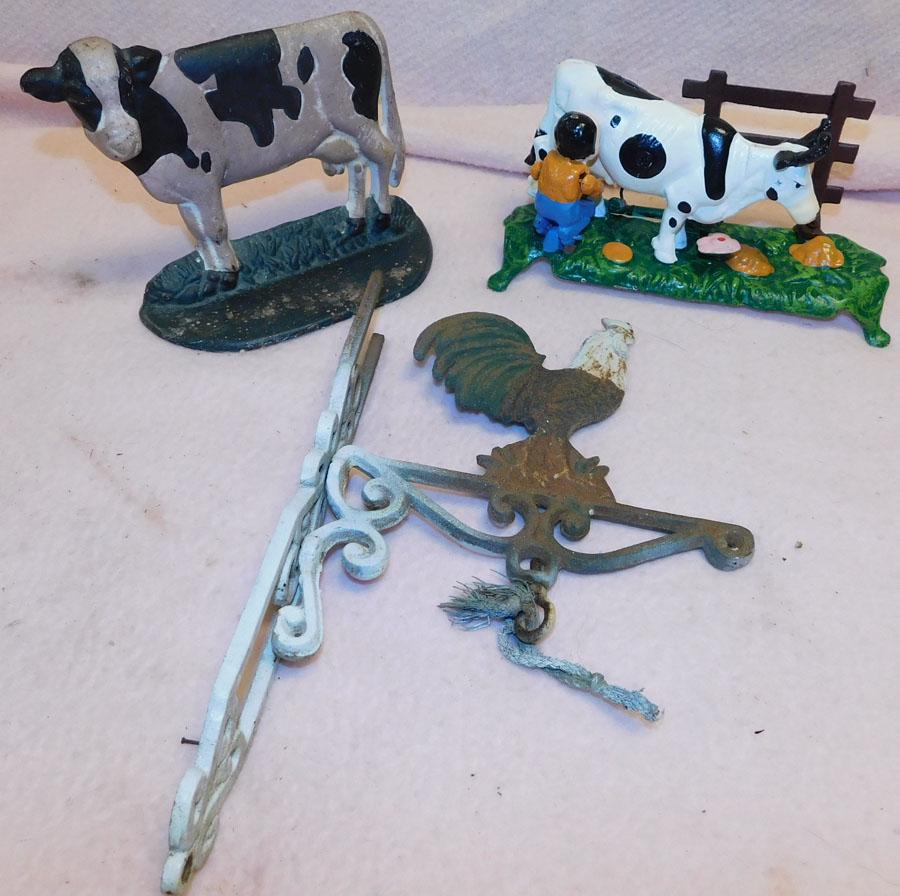 Three Cast Iron Items -- Cow Bank -- Cow Door Stop -- (1 of 3)