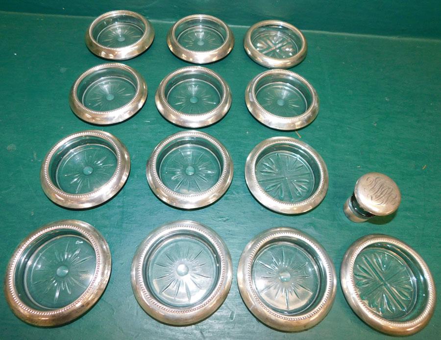 14 Sterling Rimmed Coasters & 1 Sterling Top Stopper: 14 Sterling Rimmed Coasters & 1 Sterling Top Stopper. 4" Dia