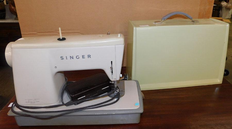 Singer Sewing Machine: Singer Sewing Machine. 17 1/2" W 8 1/2" D 15" H