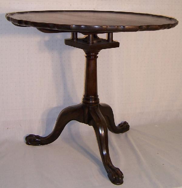 18th c birdcage piecrust tilt top tea table: 18th century birdcage with piecrust 2 board tilt top tea table. Walnut. 32 1/2 " with grain, 32 3/16" against the grain.27 3/8" tall.
