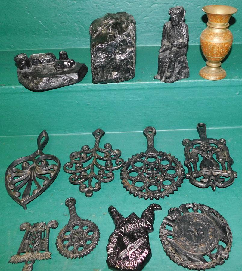 Lot of Coal Figurines & Cast Iron Trivets: Lot of Coal Figurines & Cast Iron Trivets.