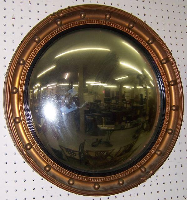19th century bulls' eye mirror. 22 1/2" diameter.: 19th century bulls' eye mirror. 22 1/2" diameter.
