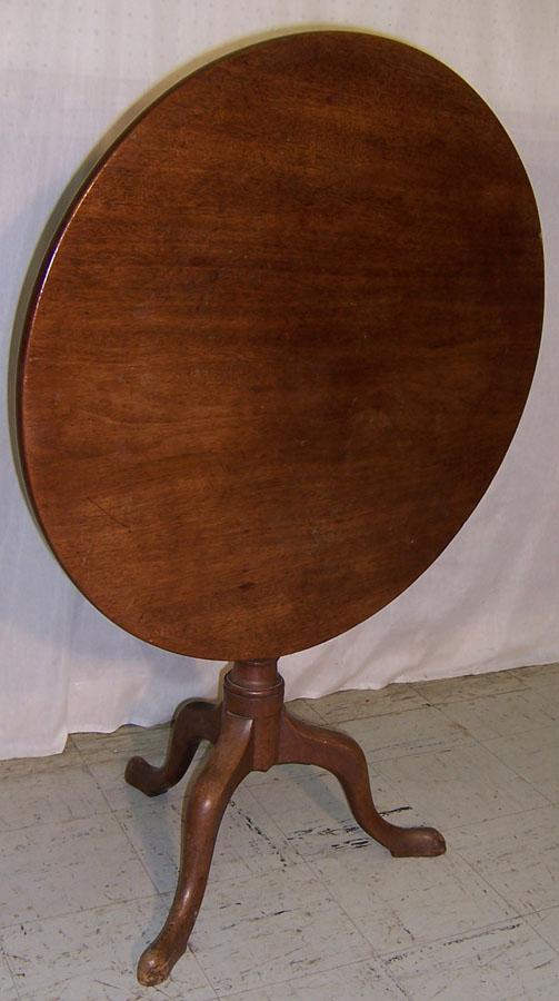 18th century mahogany 1 board top tilt top table.: 18th century mahogany 1 board top tilt top table. 30 3/4" with the grain and 29 7/8" diameter against the grain.