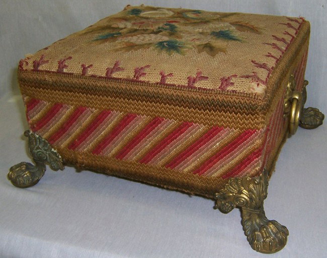 French needlepoint brass footed stool: French needlepoint brass footed stool from Greensboro estate.
