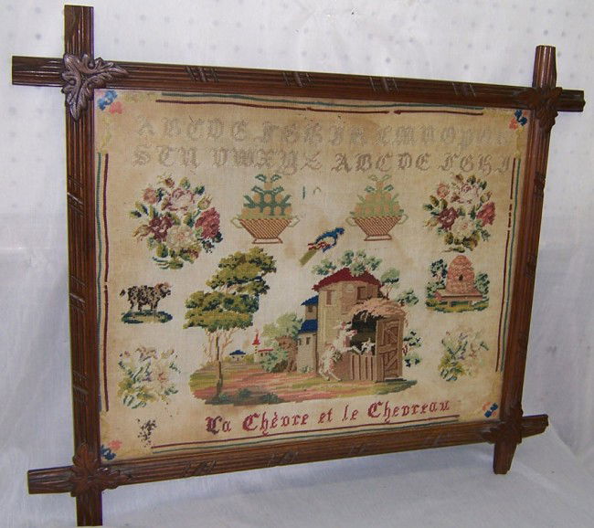 Early Needlework sampler "Le Chevre et Le Chevreau: Early Needlework sampler in walnut frame. "Le Chevre et Le Chevreau." 26" x 22".