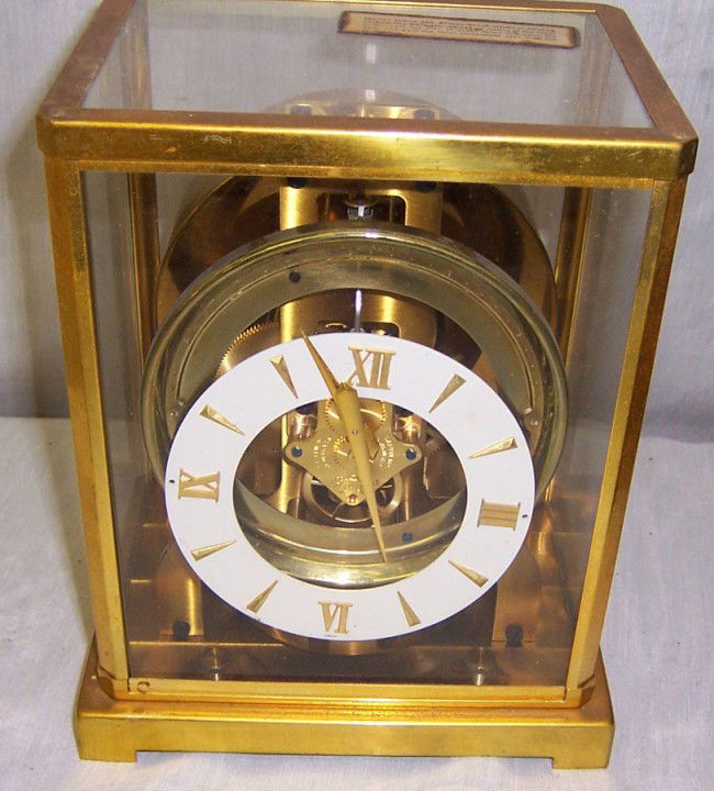 Le Coulter atmos clock with original case.: Le Coulter atmos clock with original case. Serial # 94161. 6 1/2" wide x 8 1/2" tall x 5 1/2" deep.