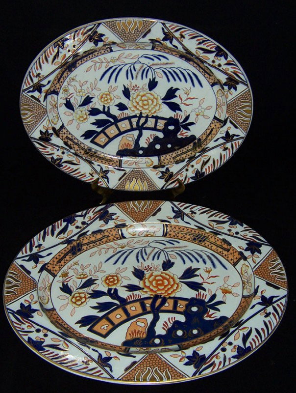 (2) early Ironstone platters: (2) early Ironstone platters with Derby type decoration. 19" x 15 1/4" and 17" x 13 1/2".
