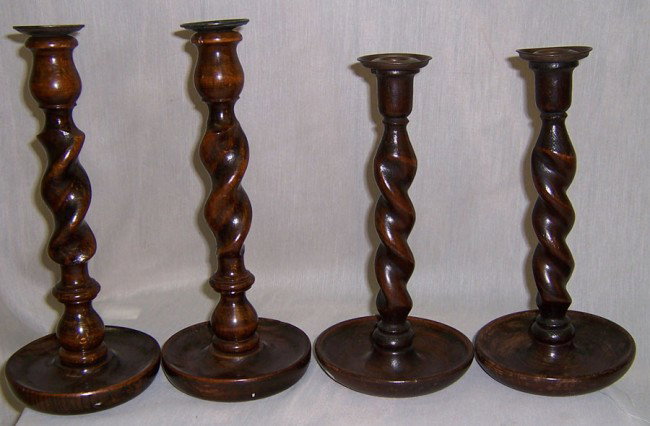 2 pr barley twist English oak candlesticks: 2 pair of open work barley twist English oak candlesticks. 1 is 12" high other is 10" high.