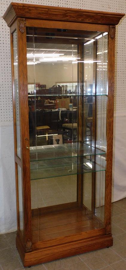 Oak Lighted Curio Cabinet By Howard Miller (1 of 9)