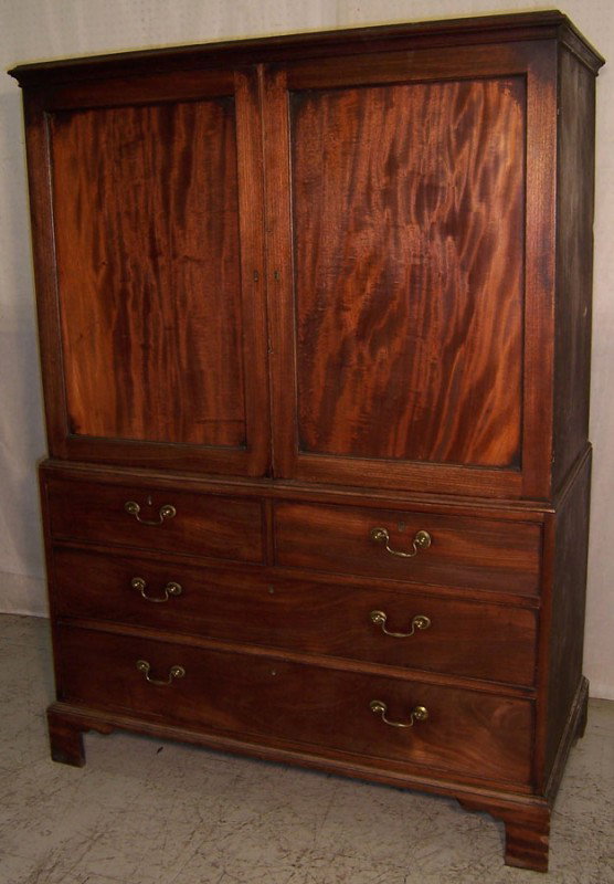 18th century mahogany linen press: 18th century mahogany linen press with original brasses and feet. 48" wide x 23 1/2" deep x 67" 1/4" tall.