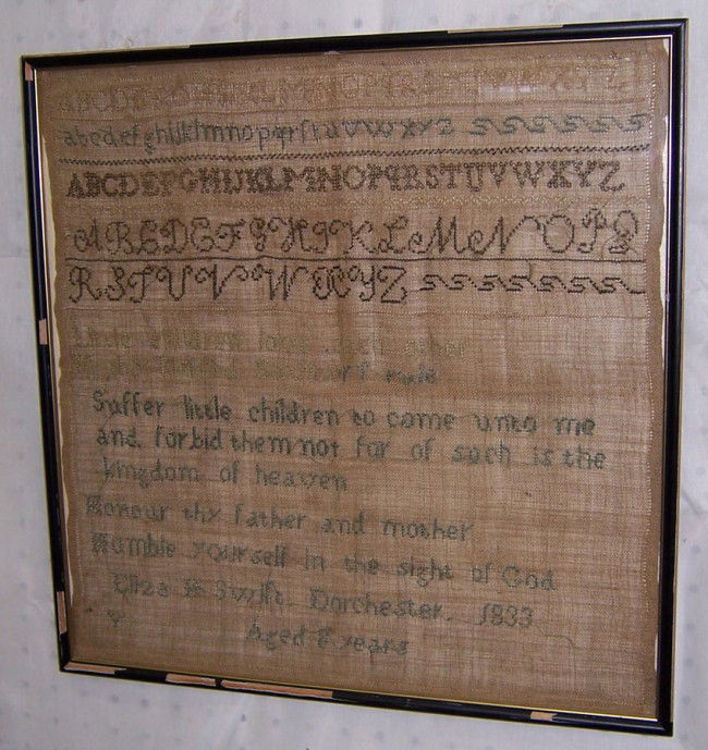 Needlework sampler . Signed Elizabeth Swift: Needlework sampler . Signed Elizabeth Swift, Dorchester, 1883, Age 8. 17" x 17 1/4".