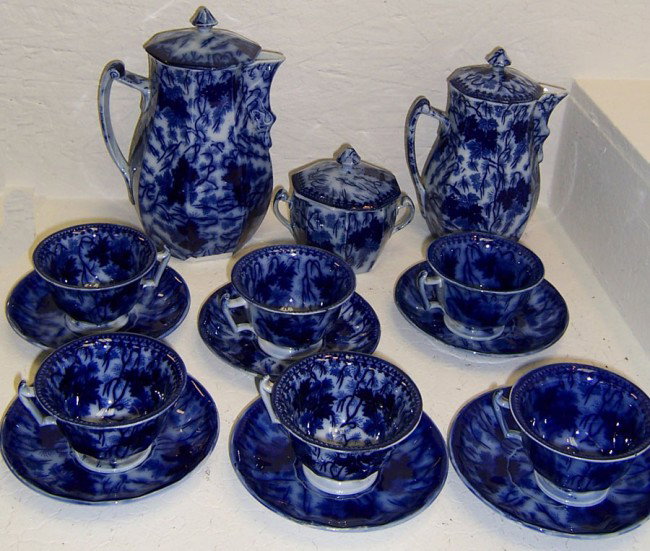 Early Flow blue English tea set, 15 pieces.: Early Flow blue English tea set, 15 pieces. 1 saucer with crack.
