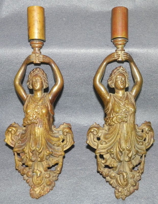 Pair of brass or bronze figural wall sconces.: Pair of brass or bronze figural wall sconces.