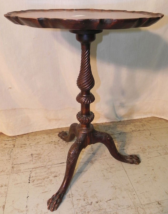 Mahogany pie crust edge candle stand: Mahogany pie crust edge candle stand with hairy paw feet.17 1/2" x 14" x 23 1/2".