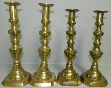 (2) pr 19th c. brass pushup beehive candlesticks.: (2) pair of 19th century brass pushup beehive candlesticks. 11" and 12" tall.