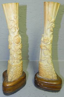 Pair of ivory or bone carved spill vases.: Pair of ivory or bone carved spill vases. 10" tall with base.