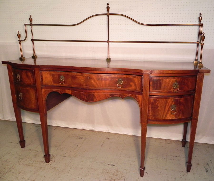 Serpentine front inlaid mahogany HW side board: Serpentine front inlaid mahogany Hepplewhite side board with brass gallery. 72" long 25" deep x 55" tall with gallery.