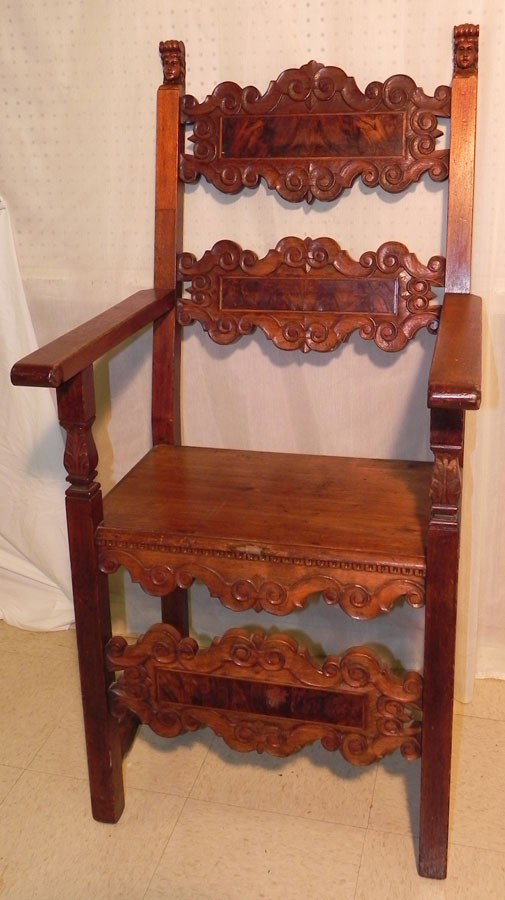 Antique Spanish arm chair w/ jellif carved heads.: Antique Spanish arm chair with jellif carved heads. 49 1/2" tall back.