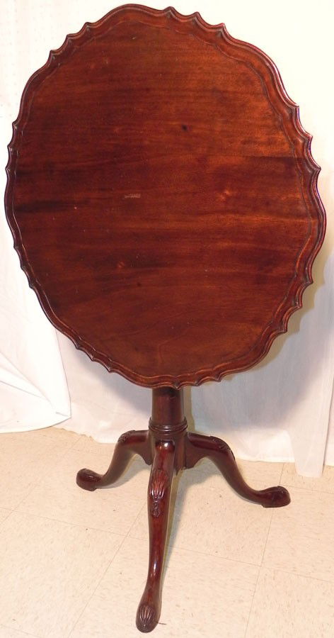 18th c mahogany tilt top table with bird cage.: 18th century mahogany tilt top table with bird cage. 27" diameter with the grain and 26 3/4" against the grain.