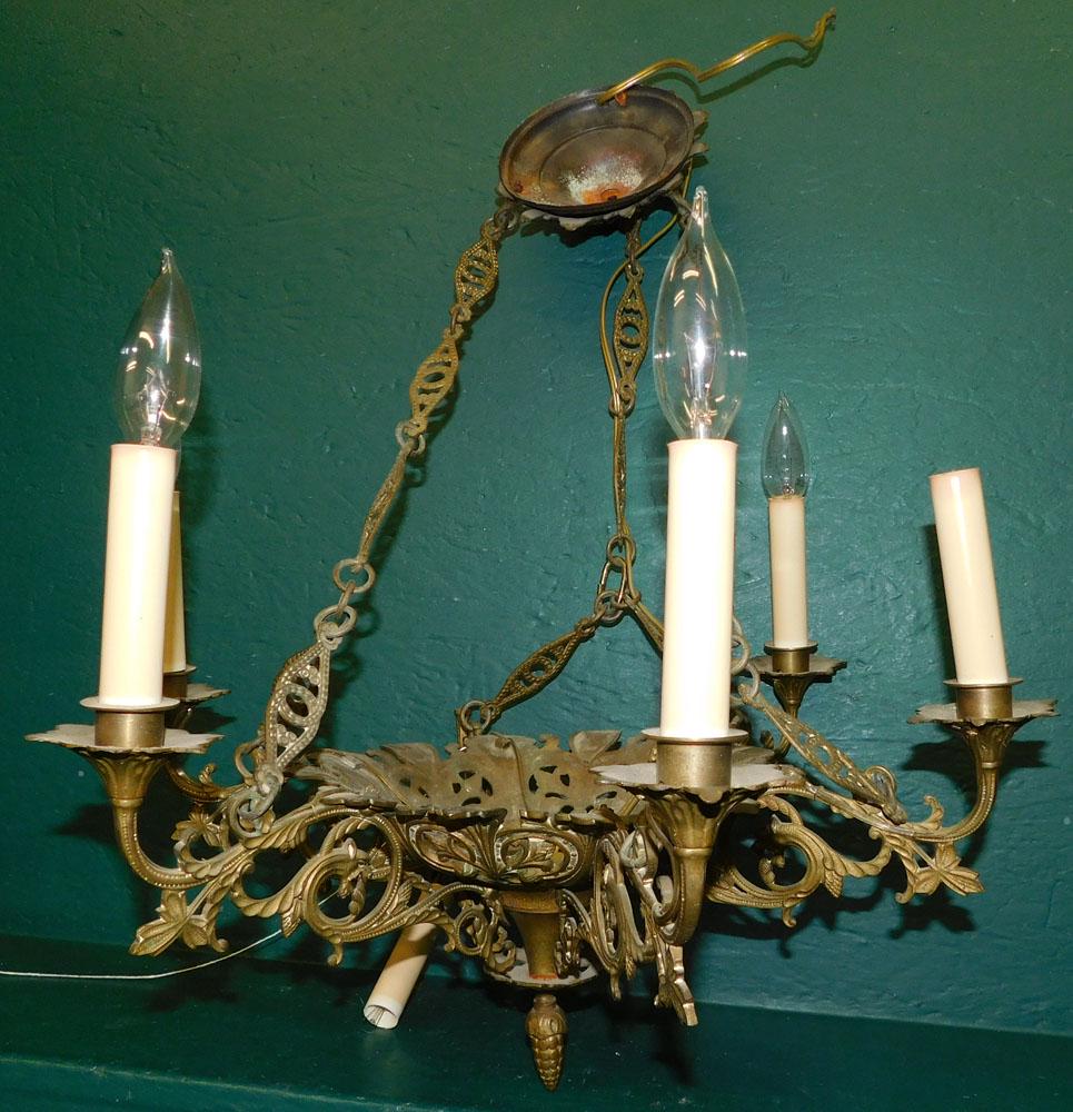 Cast Bronze 6 Light Chandelier: Cast Bronze 6 Light Chandelier . 20 1/2" Dia. 24" H ALL DESCRIPTIONS AND ANY CONDITION STATEMENT GIVEN BY LANGSTON AUCTION GALLERY ARE STRICTLY AN OPINION AND LANGSTON'S SHALL HAVE NO RESPONSIBILITY F