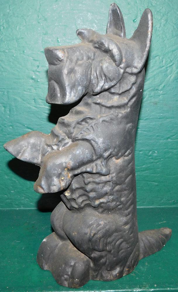 Cast Iron Door Stop of Scottish Terrier: Cast Iron Door Stop of Scottish Terrier. 14" H ALL DESCRIPTIONS AND ANY CONDITION STATEMENT GIVEN BY LANGSTON AUCTION GALLERY ARE STRICTLY AN OPINION AND LANGSTON'S SHALL HAVE NO RESPONSIBILITY FOR ER