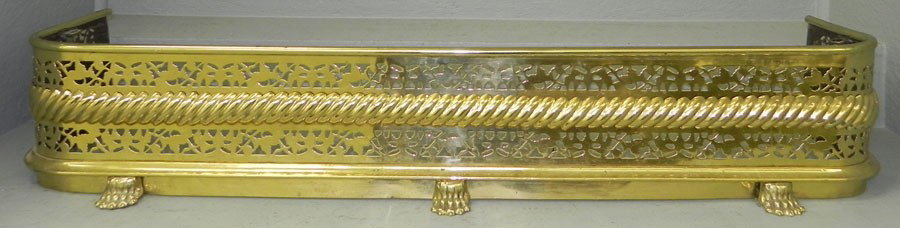 Claw foot brass fire fender. 48 1/2" long .: Claw foot brass fire fender. 48 1/2" long .