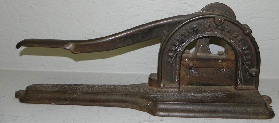 Cast iron tobacco plug cutter.: Cast iron tobacco plug cutter.