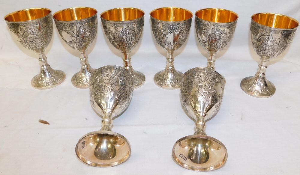 Set 8 Silverplate Repousse Wine Goblets with Gold Wash: Set 8 Silverplate Repousse Wine Goblets with Gold Wash. 6 1/2" H ALL DESCRIPTIONS AND ANY CONDITION STATEMENT GIVEN BY LANGSTON AUCTION GALLERY ARE STRICTLY OPINIONS AND LANGSTON'S SHALL HAVE NO RESPO