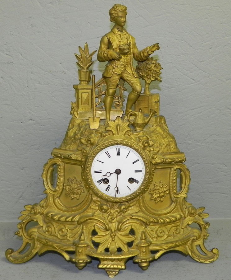 French mantle clock with figure of young man.: French mantle clock with figure of young man.