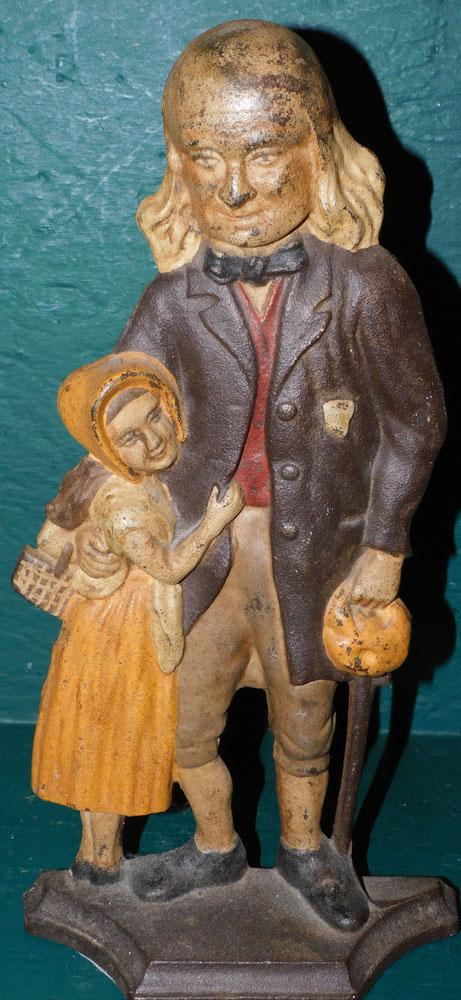 Painted Figural Cast Iron Door Stop: Painted Figural Cast Iron Door Stop. 14 1/4" H PLEASE REFER TO OUR "TERMS OF SALE" FOR FULL DISCLOSURE OF OUR POLICY. THANK YOU!"