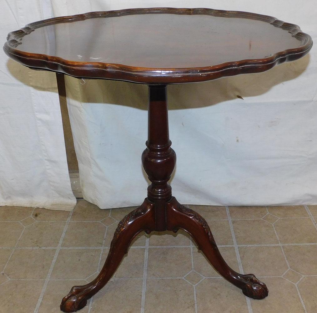 Mahogany Pie Crust Top Tilt Top Table: Mahogany Pie Crust Top Tilt Top Table. 27" Dia. 28 1/4" H "ALL DESCRIPTIONS AND ANY CONDITION STATEMENT GIVEN BY LANGSTON AUCTION GALLERY ARE STRICTLY OPINIONS AND LANGSTON'S SHALL HAVE NO RESPONSIBIL