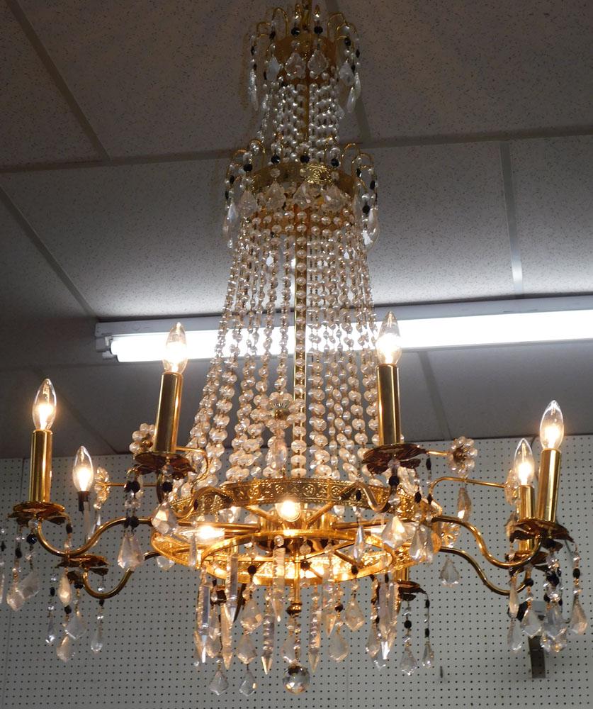 Brass & Crystal 12 Light Chandelier: Brass & Crystal 12 Light Chandelier. 32" Dia 42" H ALL DESCRIPTIONS AND ANY CONDITION STATEMENT GIVEN BY LANGSTON AUCTION GALLERY ARE STRICTLY OPINIONS AND LANGSTON'S SHALL HAVE NO RESPONSIBILITY FOR 
