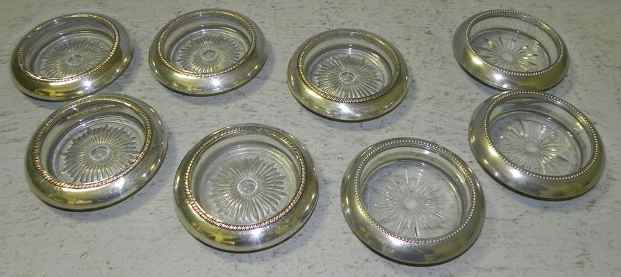 5 sterl. rimmed coasters & 3 SP rimmed coasters.: (5) sterling rimmed coasters and (3) silver plate rimmed coasters. From the Edna Boykin collection.