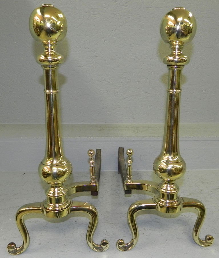 Pair of brass andirons in cannonball style.: Pair of brass andirons in cannonball style.