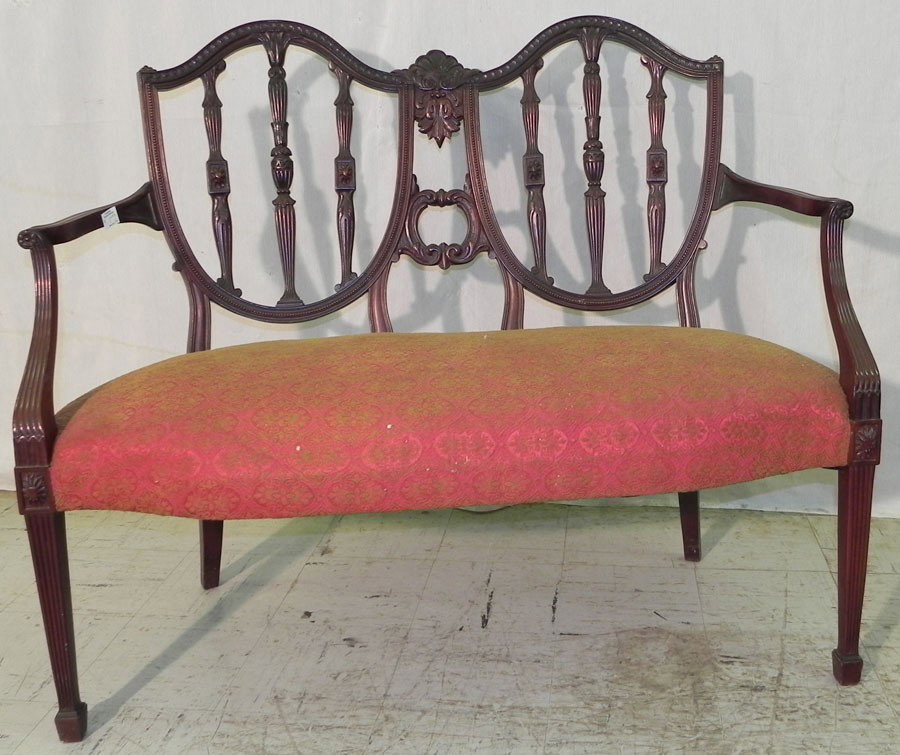 Hepplewhite carved back two seat settee.: Hepplewhite carved back two seat settee.