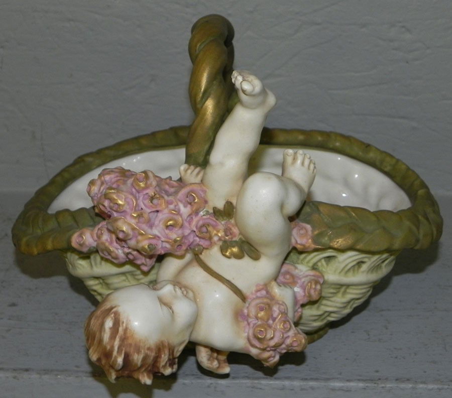 Amphora basket dish with cupid.: Amphora basket dish with cupid. 9" wide x 7 3/4" deep x 7 1/2" tall.