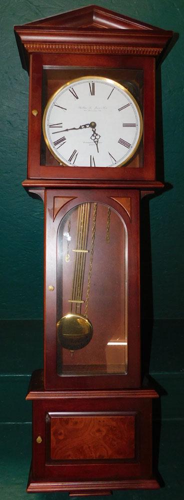 Mahogany Wall Clock: Mahogany Wall Clock. 39 1/2" H "ALL DESCRIPTIONS AND ANY CONDITION STATEMENT GIVEN BY LANGSTON AUCTION GALLERY ARE STRICTLY OPINIONS AND LANGSTON'S SHALL HAVE NO RESPONSIBILITY FOR ERRORS OR OMISSIONS