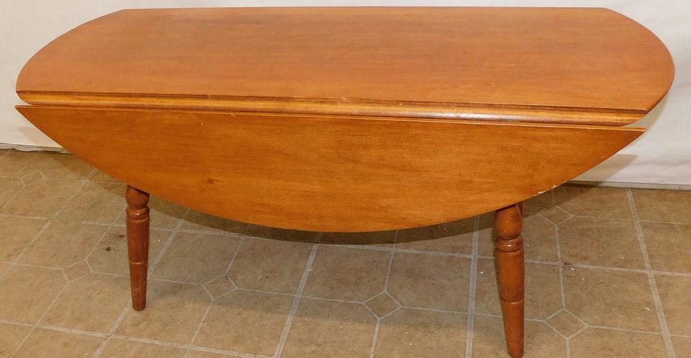 Maple Drop Leaf Coffee Table: Maple Drop Leaf Coffee Table. 38" W 15 1/4" D 17 1/2" H "ALL DESCRIPTIONS AND ANY CONDITION STATEMENT GIVEN BY LANGSTON AUCTION GALLERY ARE STRICTLY OPINIONS AND LANGSTON'S SHALL HAVE NO RESPONSIBILIT