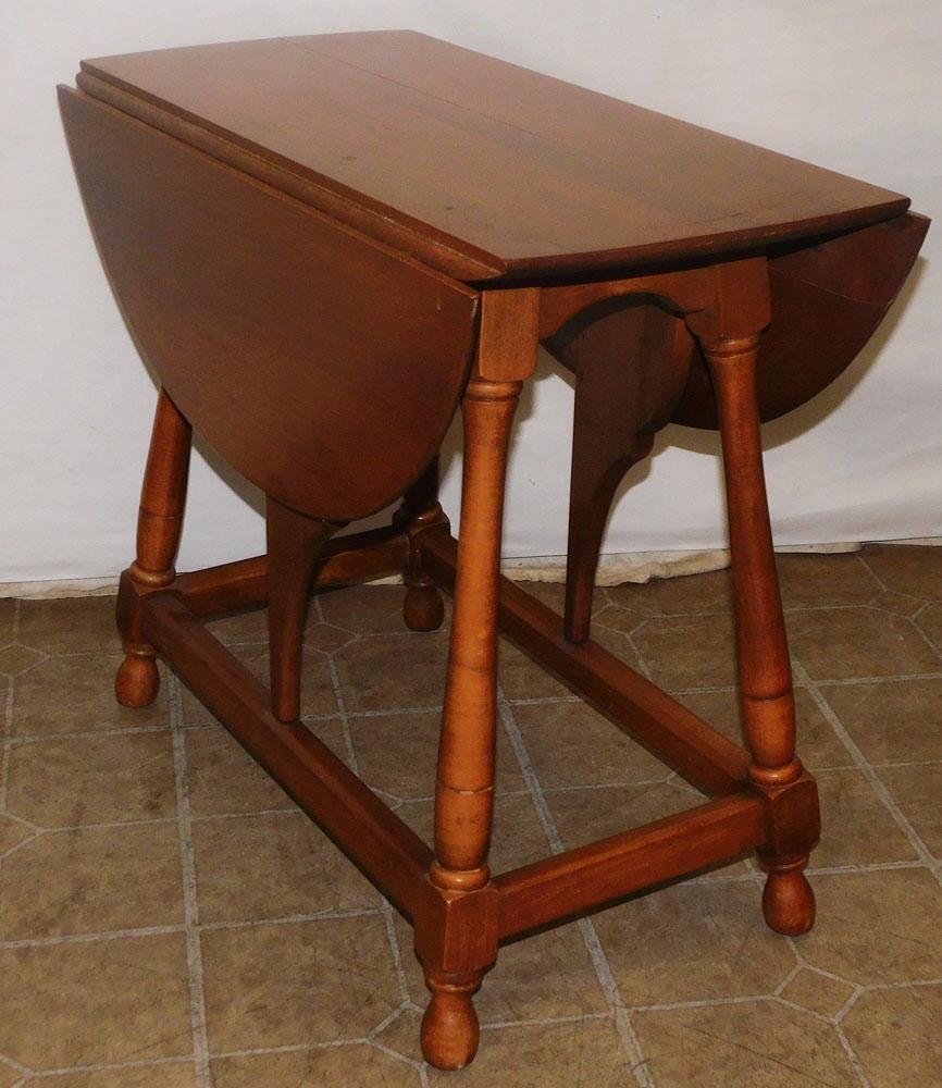 Maple Drop Leaf Table: Maple Drop Leaf Table. 26 1/4" W 14 1/4" D 23 1/2" H "ALL DESCRIPTIONS AND ANY CONDITION STATEMENT GIVEN BY LANGSTON AUCTION GALLERY ARE STRICTLY OPINIONS AND LANGSTON'S SHALL HAVE NO RESPONSIBILITY F