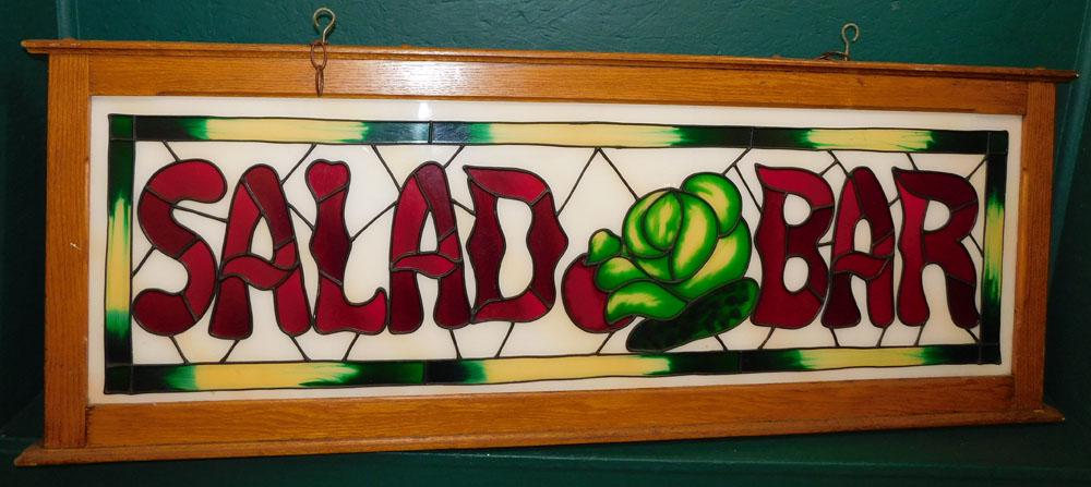 Stained Glass Salad Bar Sign in Oak Frame: Stained Glass Salad Bar Sign in Oak Frame . 56 1/4" L 20 1/2" H ALL DESCRIPTIONS AND ANY CONDITION STATEMENT GIVEN BY LANGSTON AUCTION GALLERY ARE STRICTLY OPINIONS AND LANGSTON'S SHALL HAVE NO RESPON