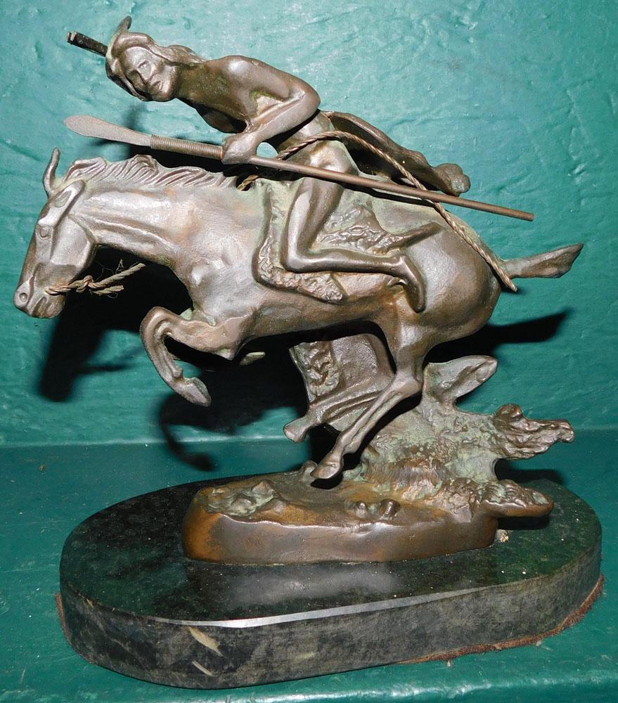 Bronze Sculpture on Marble Base by Frederic Remington: Bronze Sculpture on Marble Base by Frederic Remington. 8 1/2" H ALL DESCRIPTIONS AND ANY CONDITION STATEMENT GIVEN BY LANGSTON AUCTION GALLERY ARE STRICTLY OPINIONS AND LANGSTON'S SHALL HAVE NO RESPON