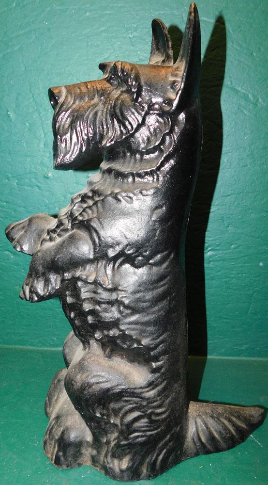 Painted Cast Iron Scottish Terrier Door Stop: Painted Cast Iron Scottish Terrier Door Stop. 16" H ALL DESCRIPTIONS AND ANY CONDITION STATEMENT GIVEN BY LANGSTON AUCTION GALLERY ARE STRICTLY OPINIONS AND LANGSTON'S SHALL HAVE NO RESPONSIBILITY FOR