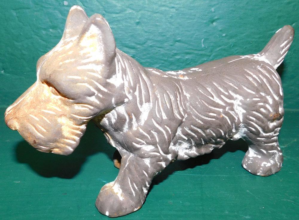Cast Iron Scottish Terrier Door Stop: Cast Iron Scottish Terrier Door Stop. 5 1/2" H ALL DESCRIPTIONS AND ANY CONDITION STATEMENT GIVEN BY LANGSTON AUCTION GALLERY ARE STRICTLY OPINIONS AND LANGSTON'S SHALL HAVE NO RESPONSIBILITY FOR ERRO
