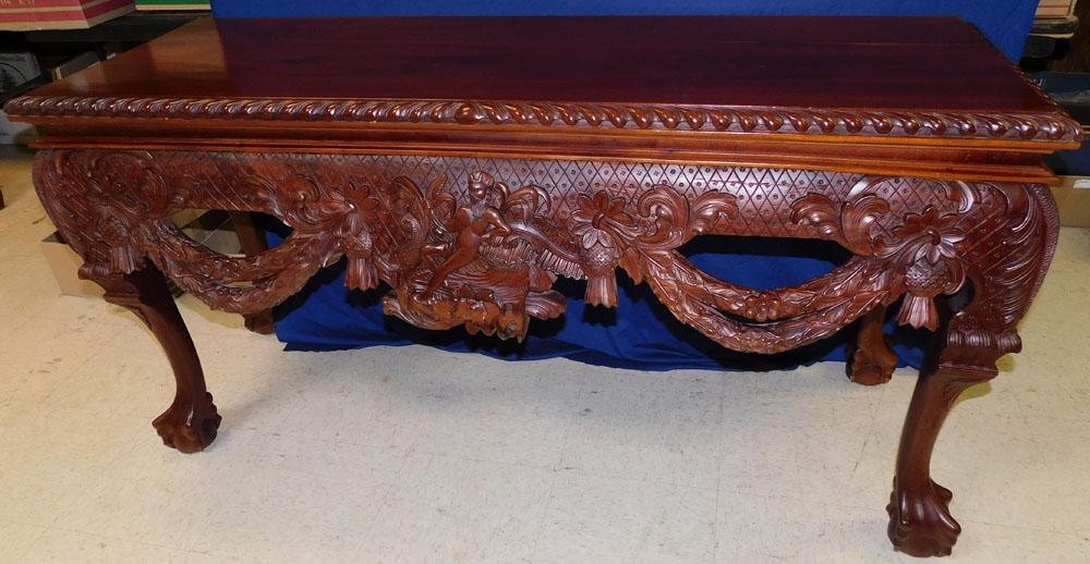 Carved Mahogany Console with Claw Feet: Carved Mahogany Console with Claw Feet. 60" L 21" D 30 1/4" H ALL DESCRIPTIONS AND ANY CONDITION STATEMENT GIVEN BY LANGSTON AUCTION GALLERY ARE STRICTLY OPINIONS AND LANGSTON'S SHALL HAVE NO RESPONSI