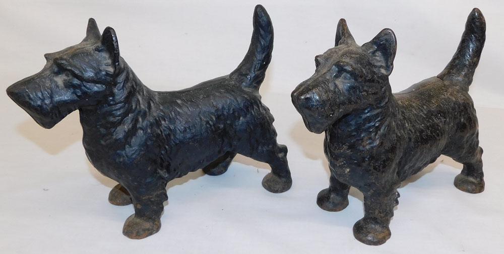 Pair of Painted Cast Iron Scottish Terrier Door Stops: Pair of Painted Cast Iron Scottish Terrier Door Stops. 8" H ALL DESCRIPTIONS AND ANY CONDITION STATEMENT GIVEN BY LANGSTON AUCTION GALLERY ARE STRICTLY OPINIONS AND LANGSTON'S SHALL HAVE NO RESPONSIBI