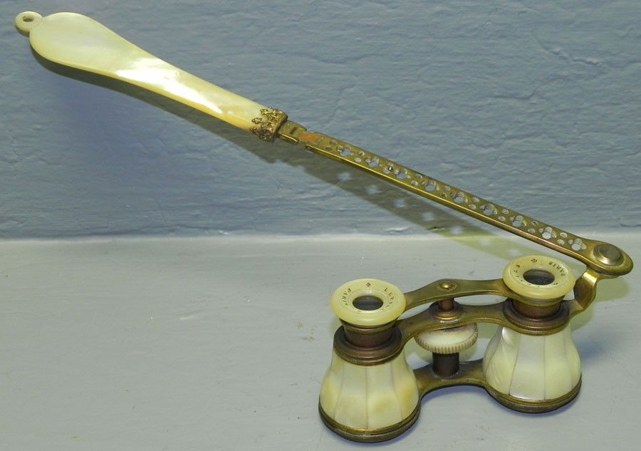 Pair of mother of pearl and brass opera glasses.: Pair of mother of pearl and brass opera glasses.