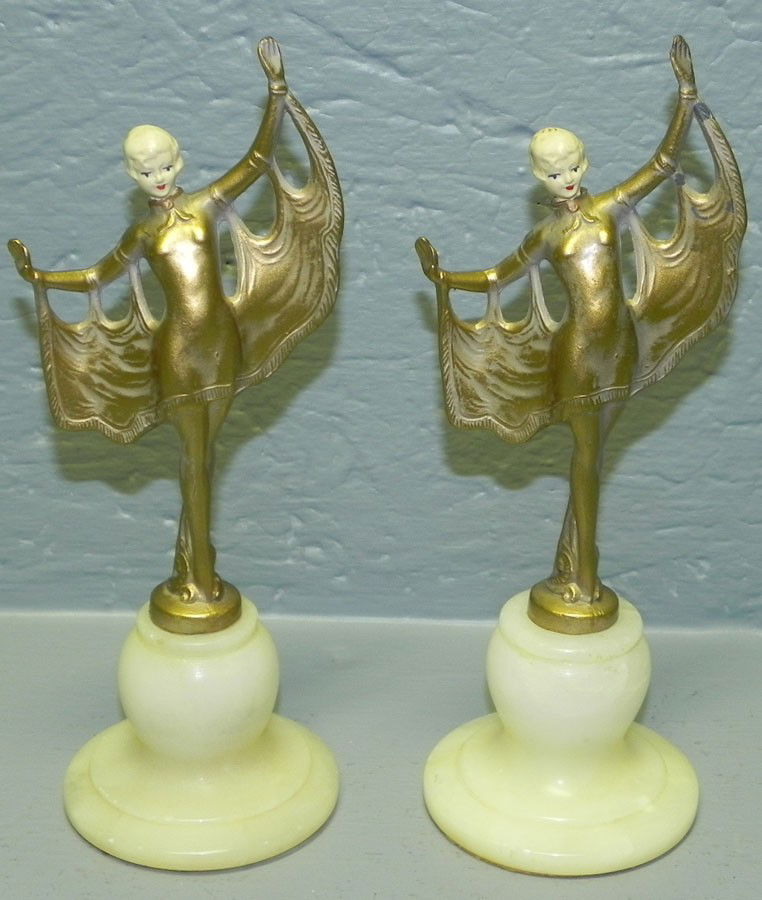 Pair of Art Deco figurines with alabaster base.: Pair of Art Deco figurines with alabaster base. 7 3/4" tall.