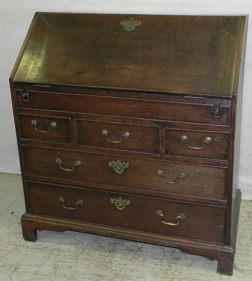 18th century English oak fall front desk: 18th century English oak fall front desk with step down interior and deep well. 36" wide x 19 1/2" deep x 39 3/8" tall.