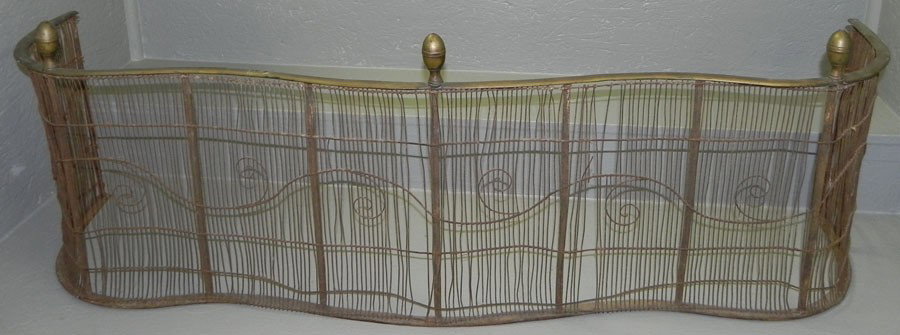 Serpentine front brass and mesh antique fender: Serpentine front brass and mesh antique fender, circa 18th century. 51" wide x 17" tall.
