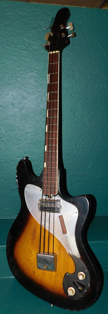 Vintage Electric Base Guitar: Vintage Electric Base Guitar. 45 1/2" L ALL DESCRIPTIONS AND ANY CONDITION STATEMENT GIVEN BY LANGSTON AUCTION GALLERY ARE STRICTLY OPINIONS AND LANGSTON'S SHALL HAVE NO RESPONSIBILITY FOR ERRORS OR O